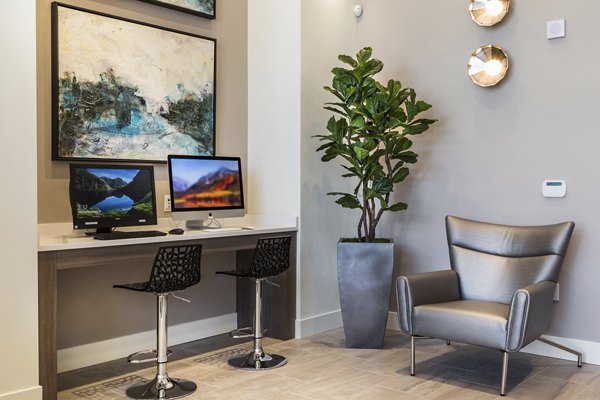 Modern business center with advanced workstations at Areum Apartments, ideal for remote work and collaboration in a luxury setting