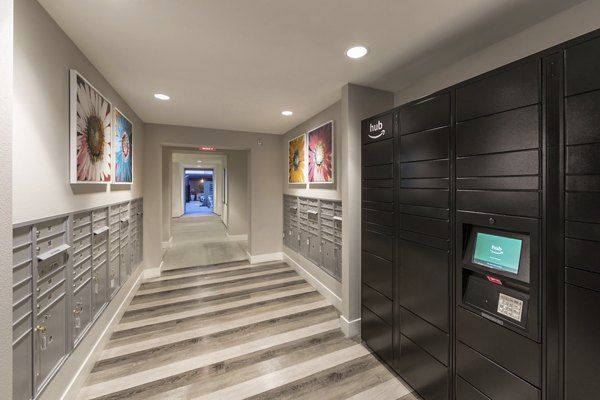Modern mail room with secure package lockers at Areum Apartments