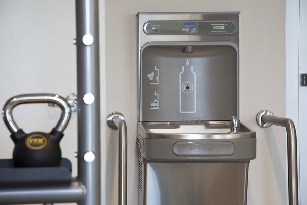State-of-the-art fitness center featuring modern equipment at Areum Apartments