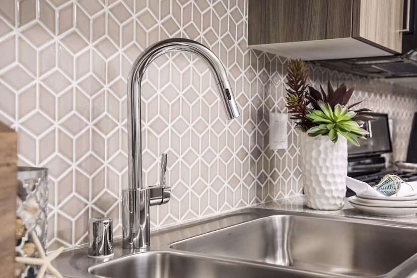 kitchen at Areum Apartments with modern appliances and sleek countertops, ideal for culinary experiences in a luxury setting