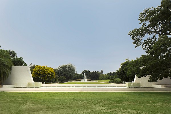 Scenic neighborhood view near Areum Apartments: tree-lined streets and local shops enhance the luxury living experience