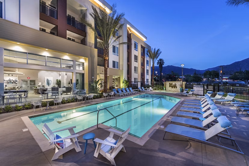 Luxurious pool with sundeck at Areum Apartments, a Greystar luxury community, offering relaxation and stunning views