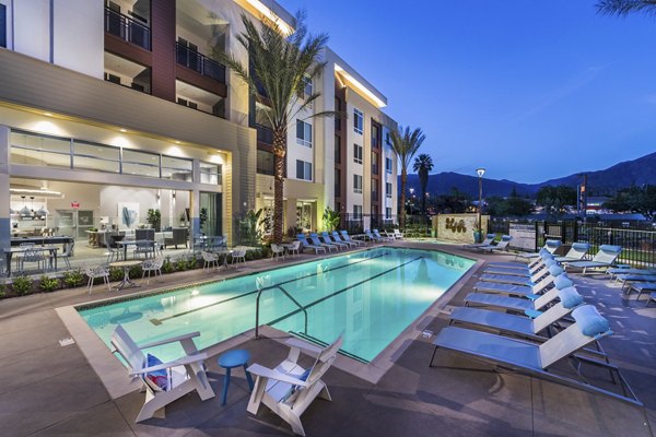 Luxurious pool with sundeck at Areum Apartments, a Greystar luxury community, offering relaxation and stunning views