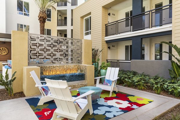 Relaxing fire pit area at Areum Apartments, a luxury Greystar community