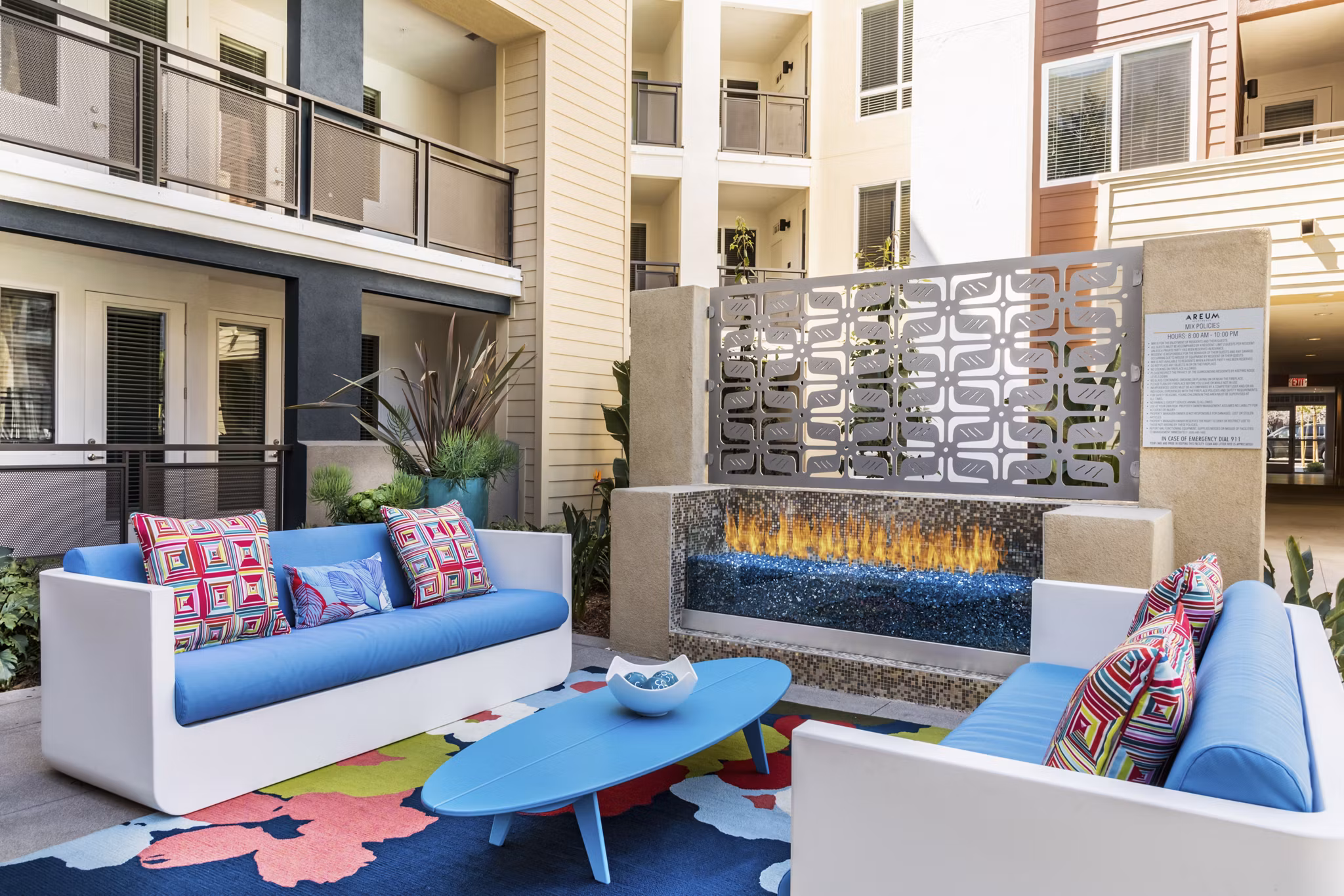 Cozy fire pit at Areum Apartments offering a stylish outdoor gathering area for residents
