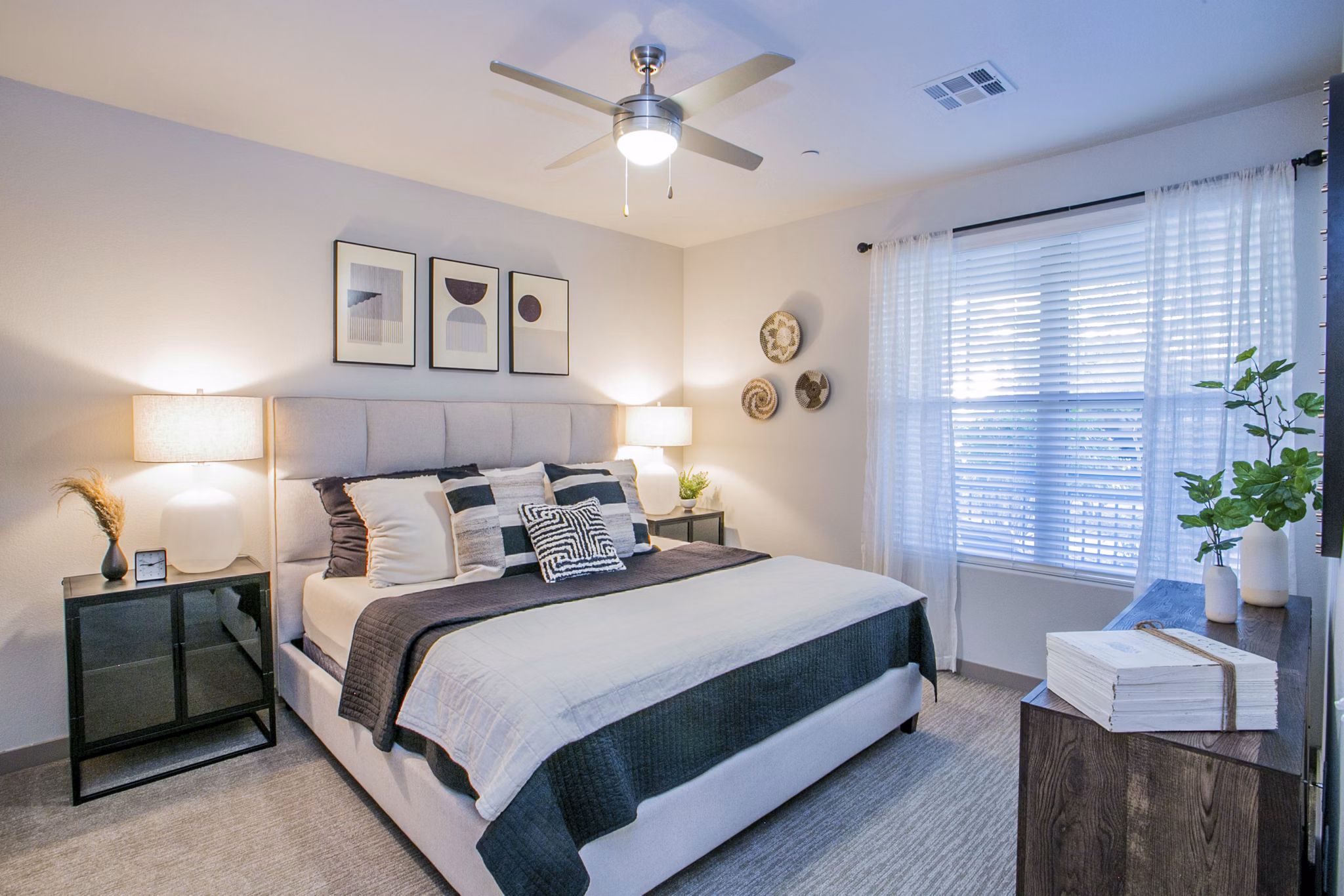 Cozy bedroom with chic decor at Volare Apartments offering luxury living in the heart of the city