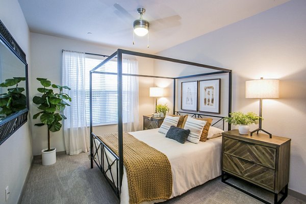 Modern bedroom with stylish decor at Volare Apartments, luxury property from Greystar