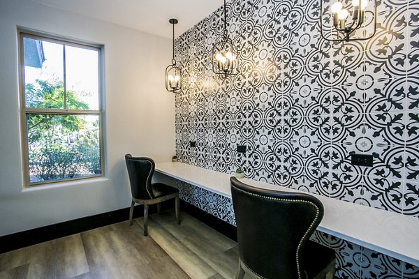 Modern business center with collaborative workspaces at Volare Apartments, ideal for productivity and networking in a luxury setting