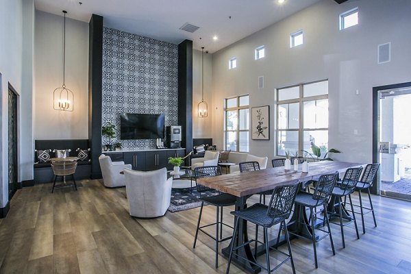 Elegant clubhouse with contemporary design at Volare Apartments, featuring luxury seating and modern lighting