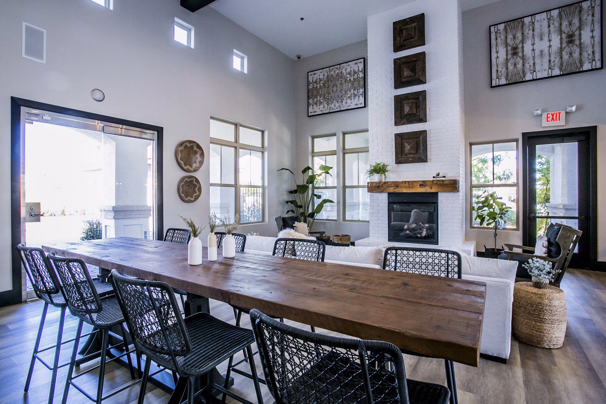 Elegant clubhouse with stylish seating and modern decor at Volare Apartments offers a perfect gathering space for residents and guests