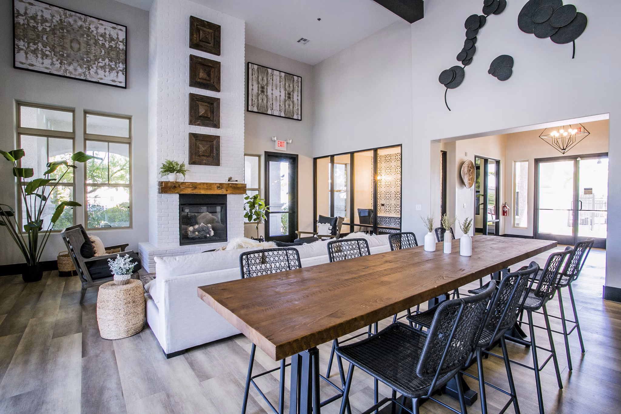Modern clubhouse with stylish seating and large TV at Volare Apartments, luxury property offering upscale living in prime location