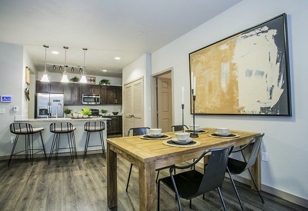 Dining area with modern decor and ample seating in Volare Apartments