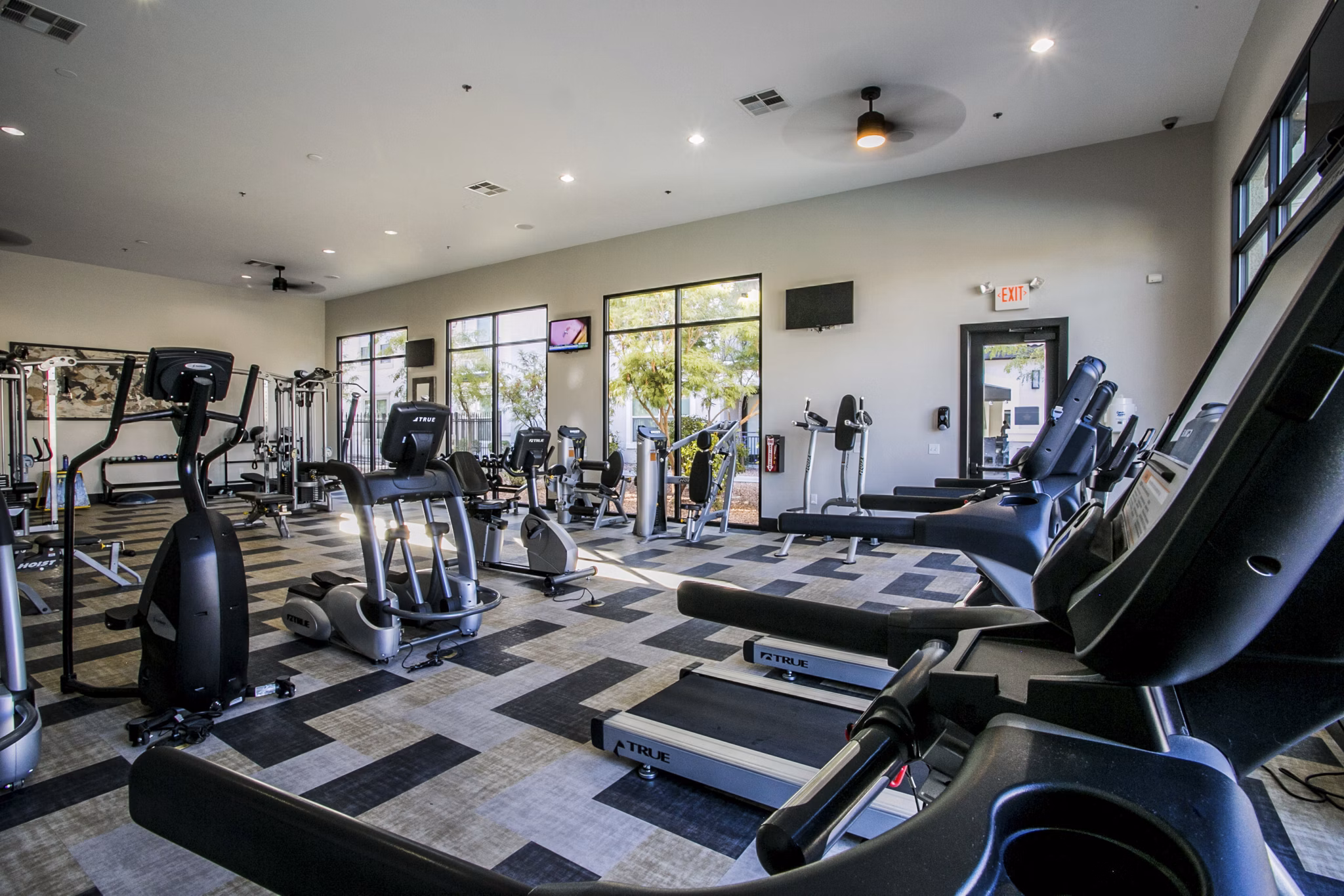 State-of-the-art fitness center with modern equipment at Volare Apartments, ideal for active residents seeking luxury living