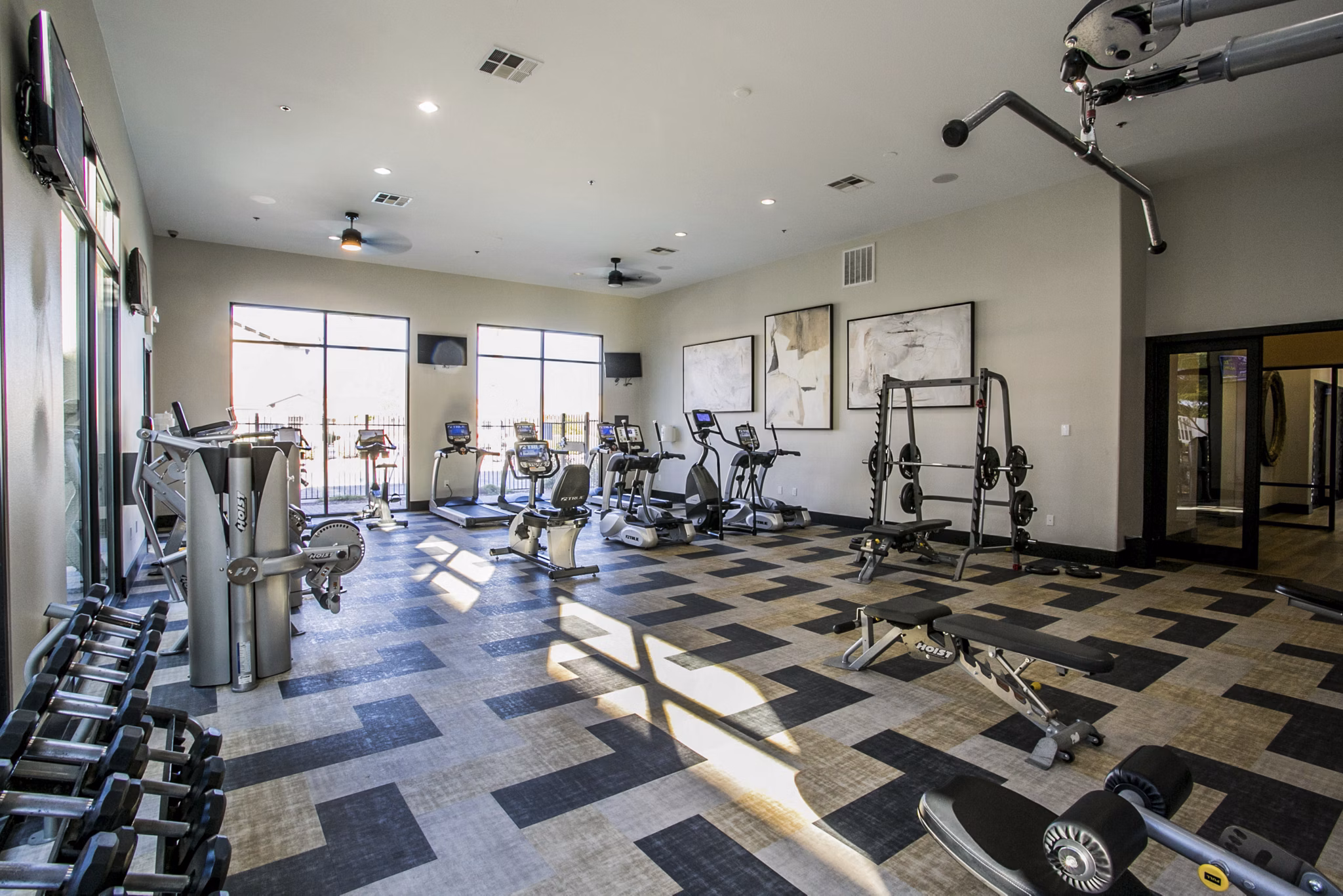Modern fitness center with state-of-the-art equipment at Volare Apartments Perfect for maintaining an active lifestyle