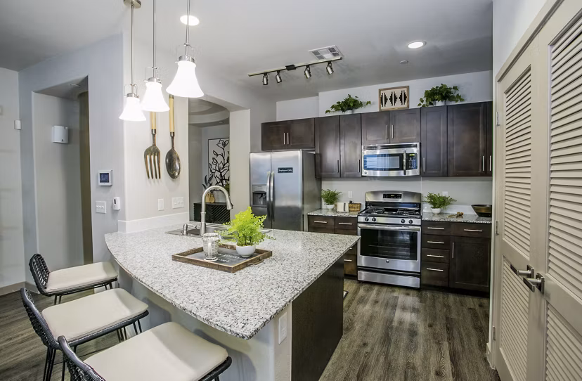 Modern kitchen with stainless steel appliances at Volare Apartments