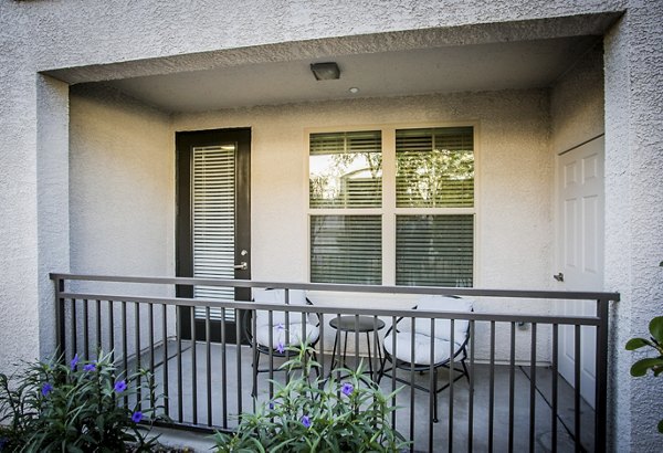 Spacious patio with outdoor seating at Volare Apartments, perfect for luxury living