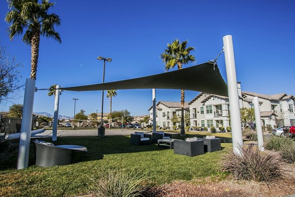Courtyard view with manicured gardens and seating area at Volare Apartments, a luxury community in the heart of vibrant urban living