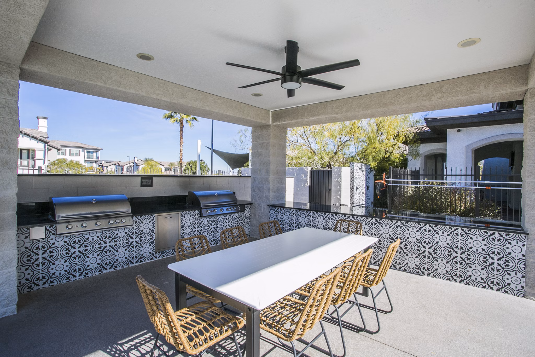 Outdoor grill area with modern seating at Volare Apartments, perfect for entertaining and relaxation