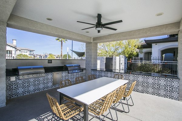 Outdoor grill area with modern seating at Volare Apartments, perfect for entertaining and relaxation