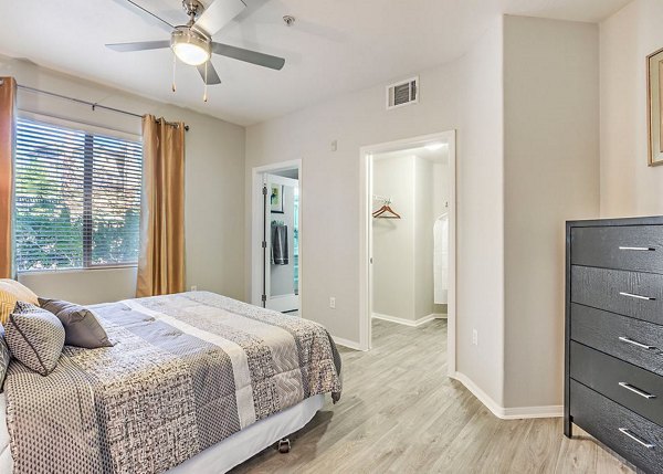 Spacious bedroom with modern furnishings at Luminous Apartments offering luxurious living options
