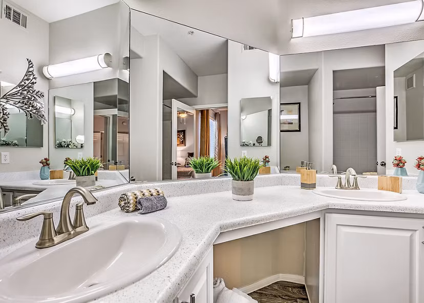 Modern bathroom with sleek fixtures and marble finishes in Luminous Apartments
