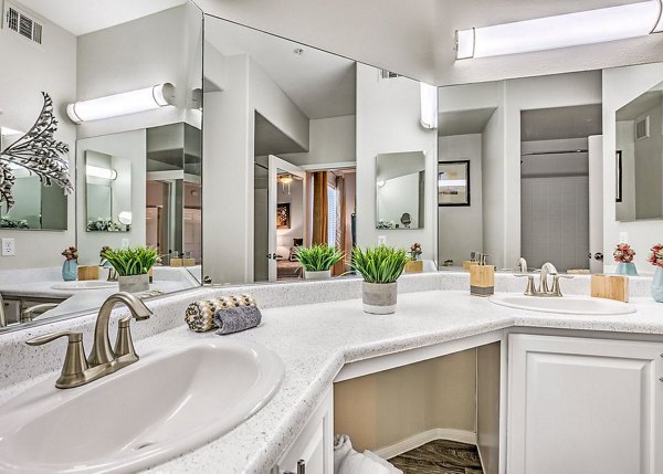 Modern bathroom with sleek fixtures and marble finishes in Luminous Apartments