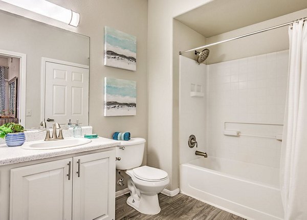 Modern bathroom with sleek fixtures and large mirror in Luminous Apartments