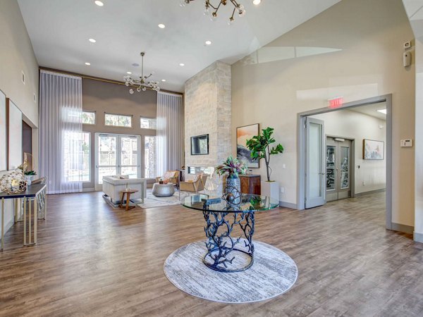 Clubhouse featuring contemporary design and spacious seating at Luminous Apartments