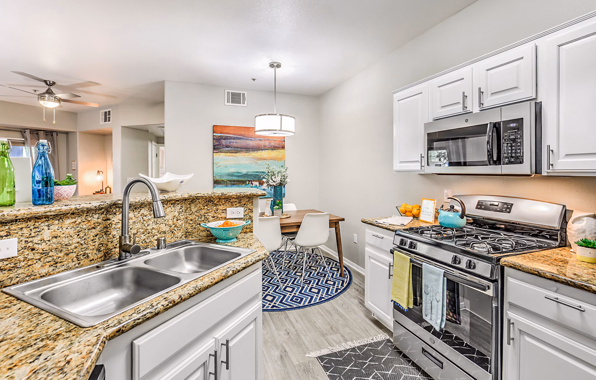 Modern kitchen with stainless steel appliances at Luminous Apartments