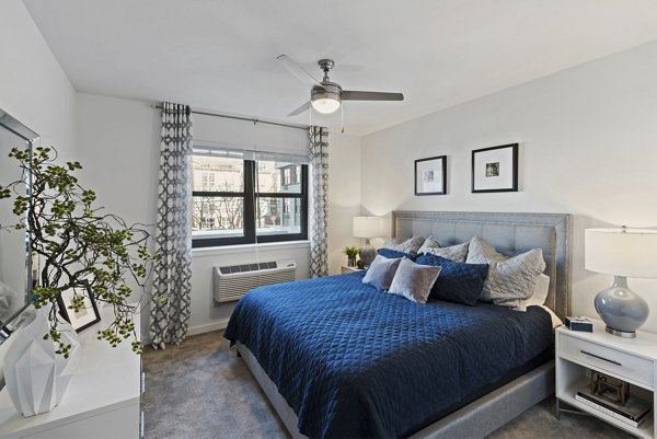 Cozy bedroom with modern decor in The Quincy Apartments