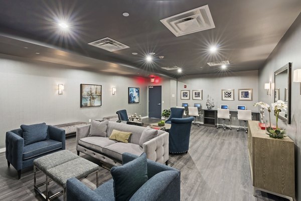 Clubhouse with modern design and comfortable seating at The Quincy Apartments