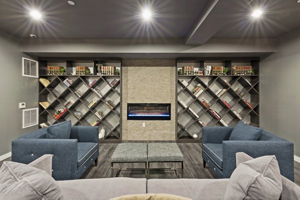 Luxury clubhouse at The Quincy Apartments featuring modern design and comfortable seating areas