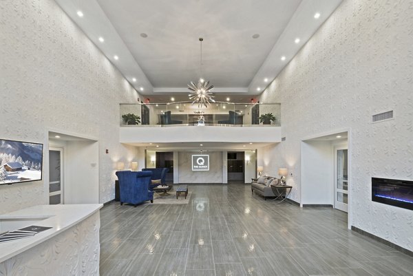 Lobby featuring modern decor and seating at The Quincy Apartments