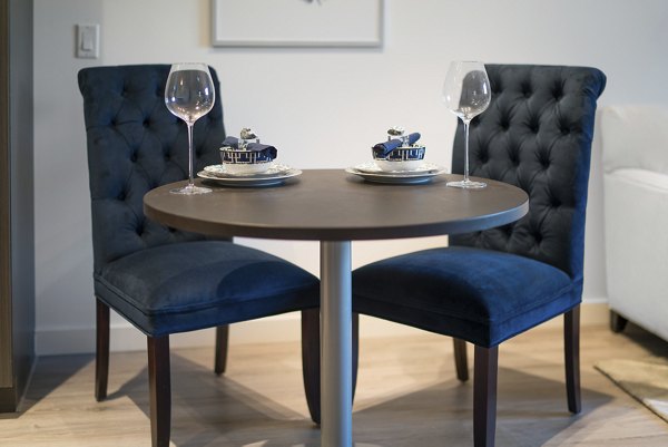 Elegant dining area with modern furnishings at The Quincy Apartments