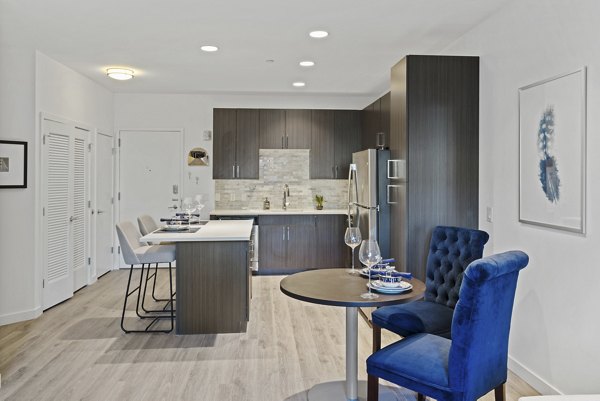 Dining area featuring modern furniture and stylish decor in The Quincy Apartments