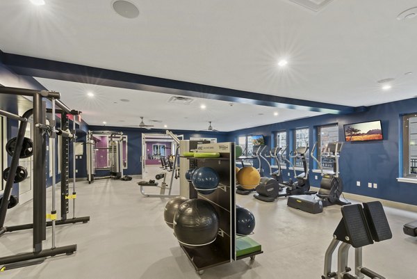 Fitness room with modern equipment at The Quincy Apartments in Atlanta, offering luxury workout spaces for residents
