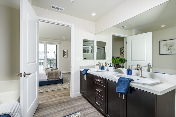 Modern bathroom featuring glass shower enclosure in Portside Ventura Harbor Apartments