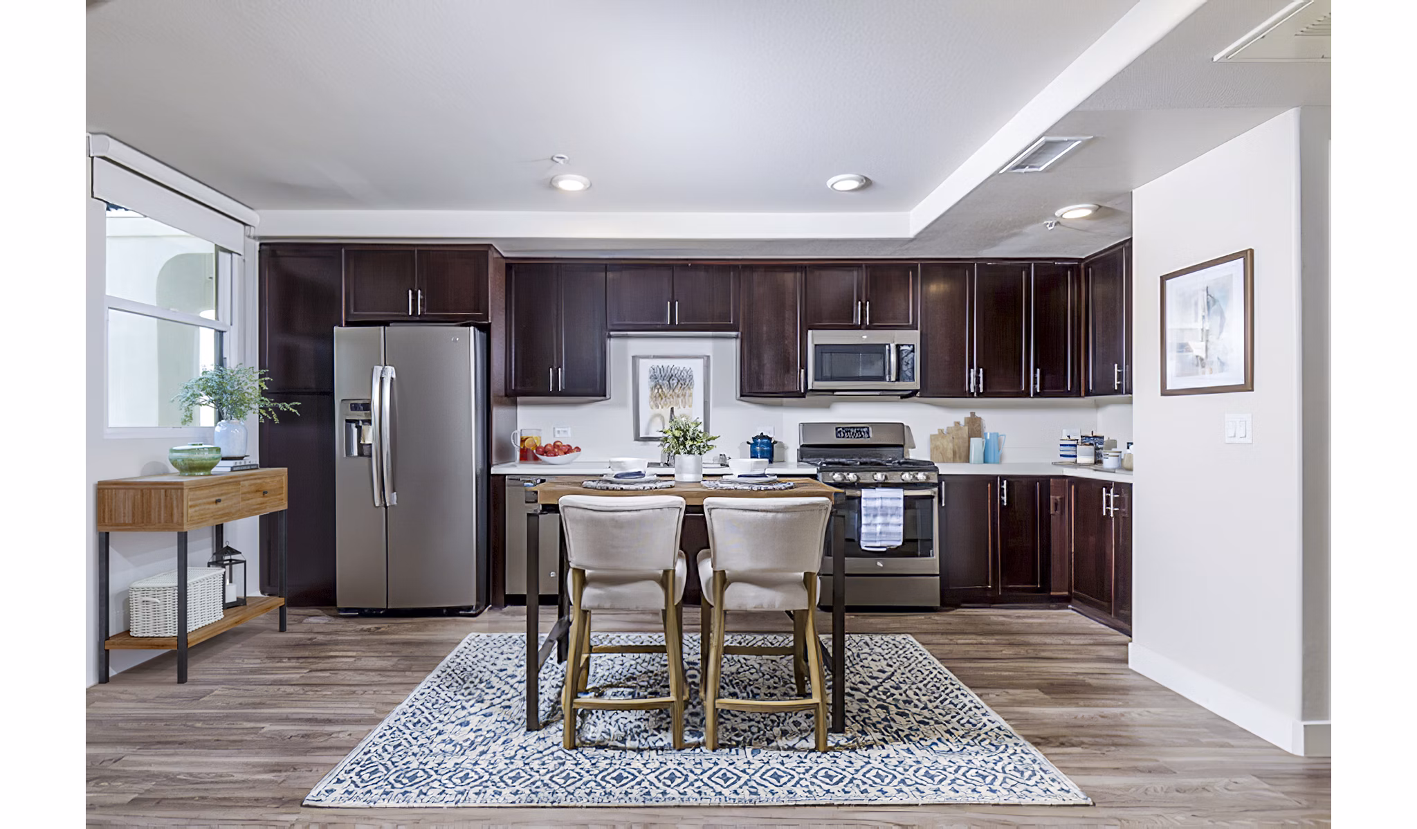Dining room with modern decor at Portside Ventura Harbor Apartments featuring elegant lighting and waterfront views