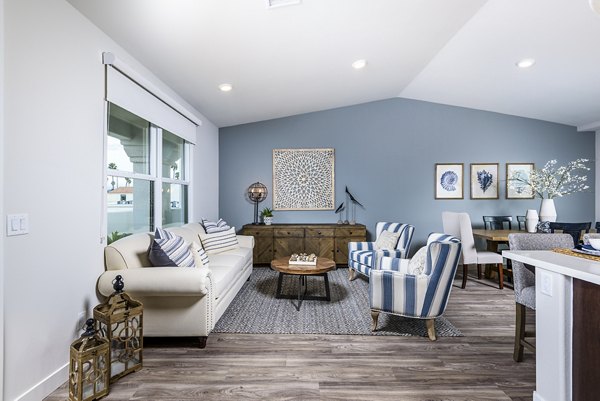 Spacious living room with coastal-inspired decor at Portside Ventura Harbor Apartments