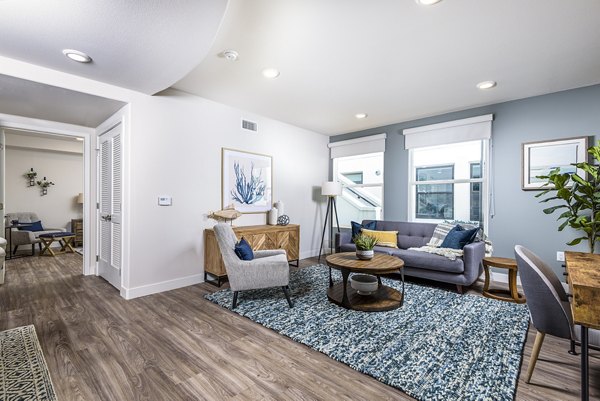 Spacious living room with modern decor in Portside Ventura Harbor Apartments