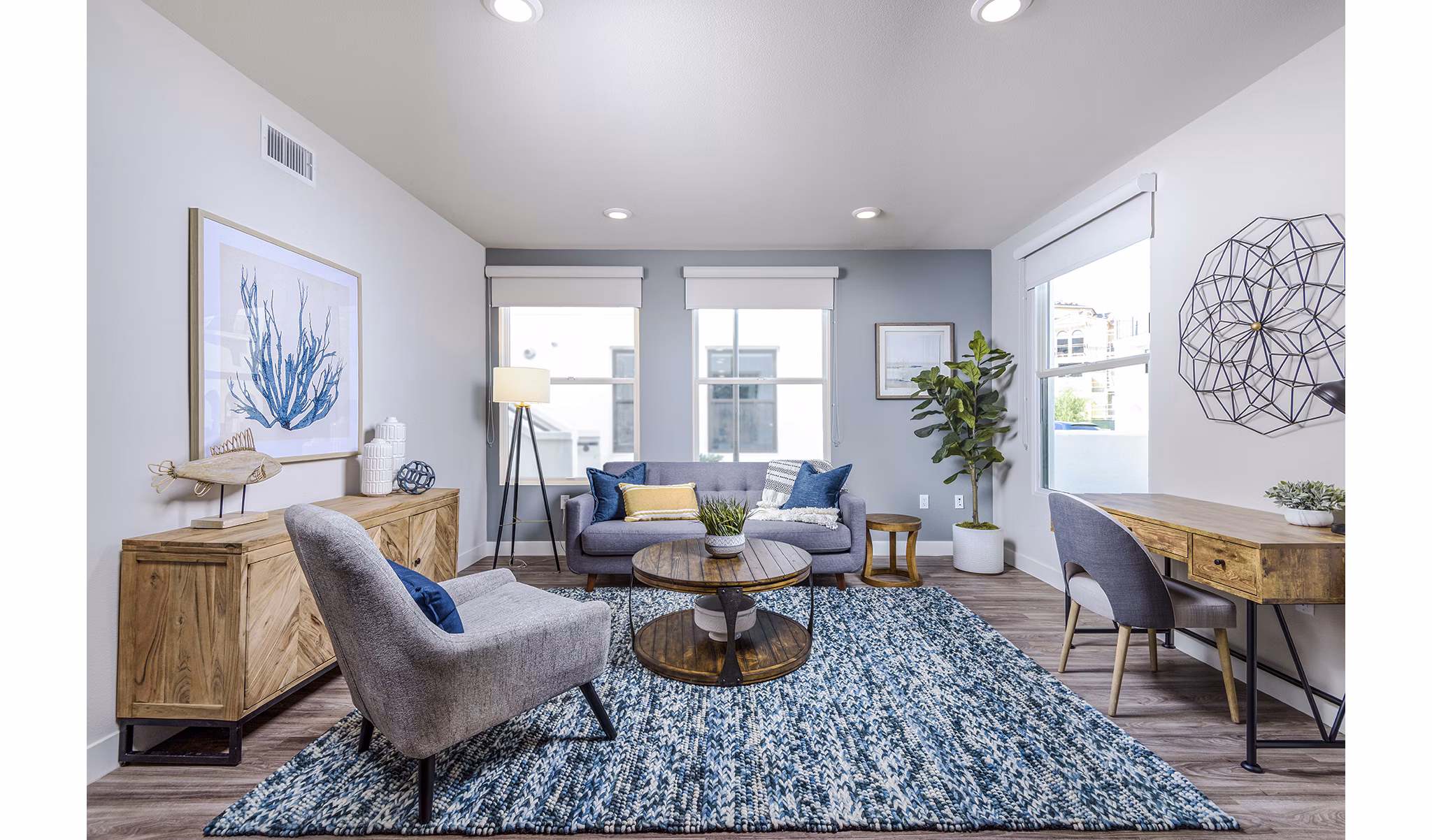 Spacious living room with coastal decor at Portside Ventura Harbor Apartments