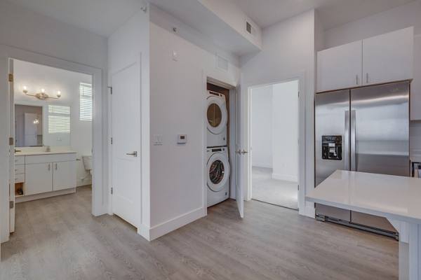 Kitchen with laundry at The Pointe Apartments
