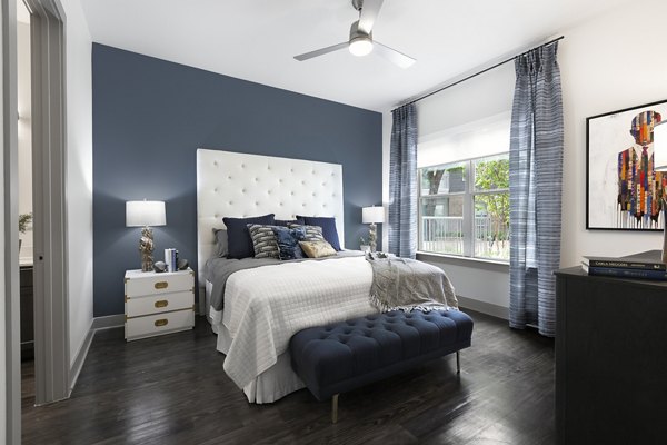 Contemporary bedroom with modern decor at Atlas Waterside Apartments