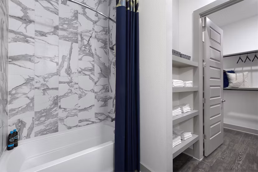 Sleek bathroom with modern fixtures at Atlas Waterside Apartments offering luxury living
