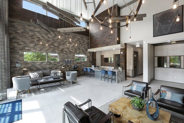 Modern clubhouse with stylish seating and entertainment areas at Atlas Waterside Apartments in Fort Worth