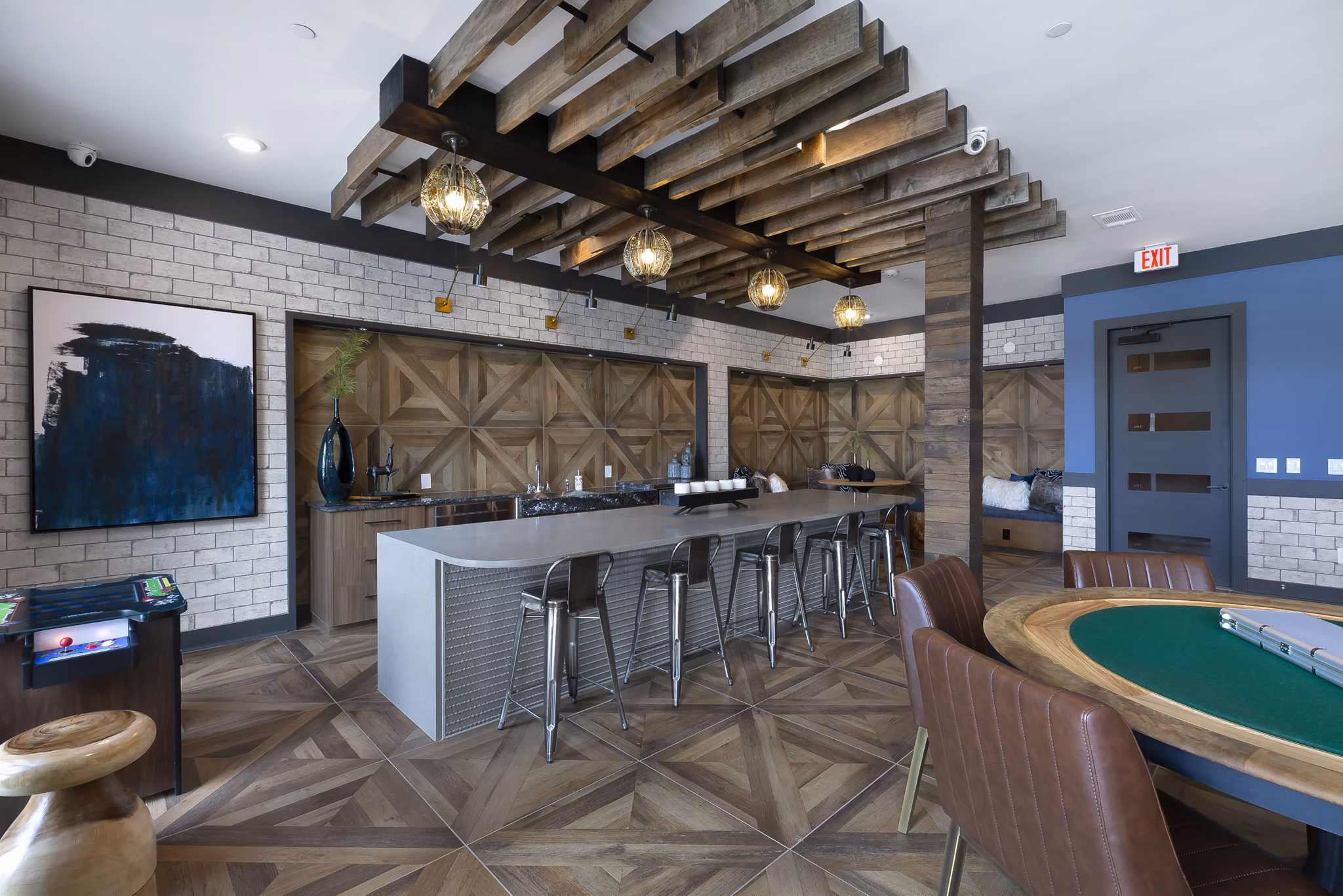Game room featuring pool tables and lounge seating in Atlas Waterside Apartments for recreation and socializing