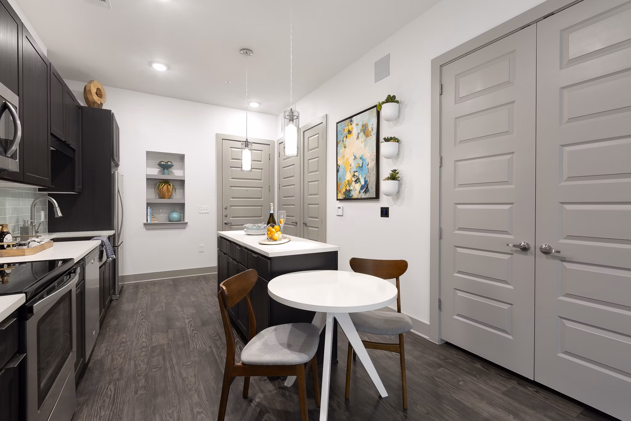 Dining area featuring modern furnishings and natural lighting in Atlas Waterside Apartments
