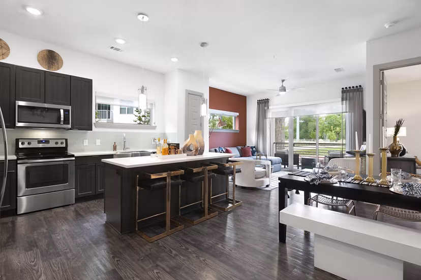 Modern kitchen featuring sleek cabinets and stainless steel appliances in Atlas Waterside Apartments, luxury living