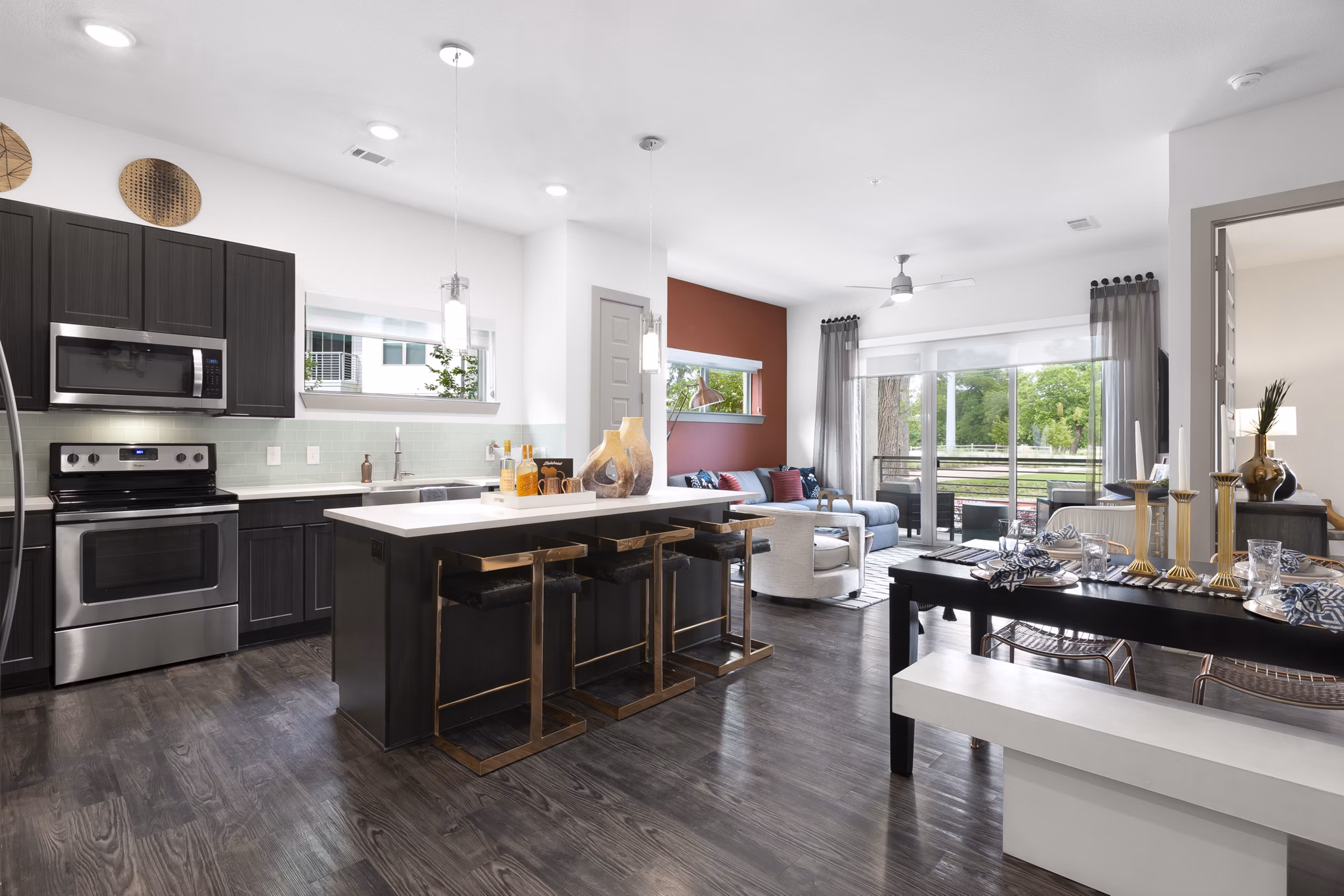 Modern kitchen featuring sleek cabinets and stainless steel appliances in Atlas Waterside Apartments, luxury living