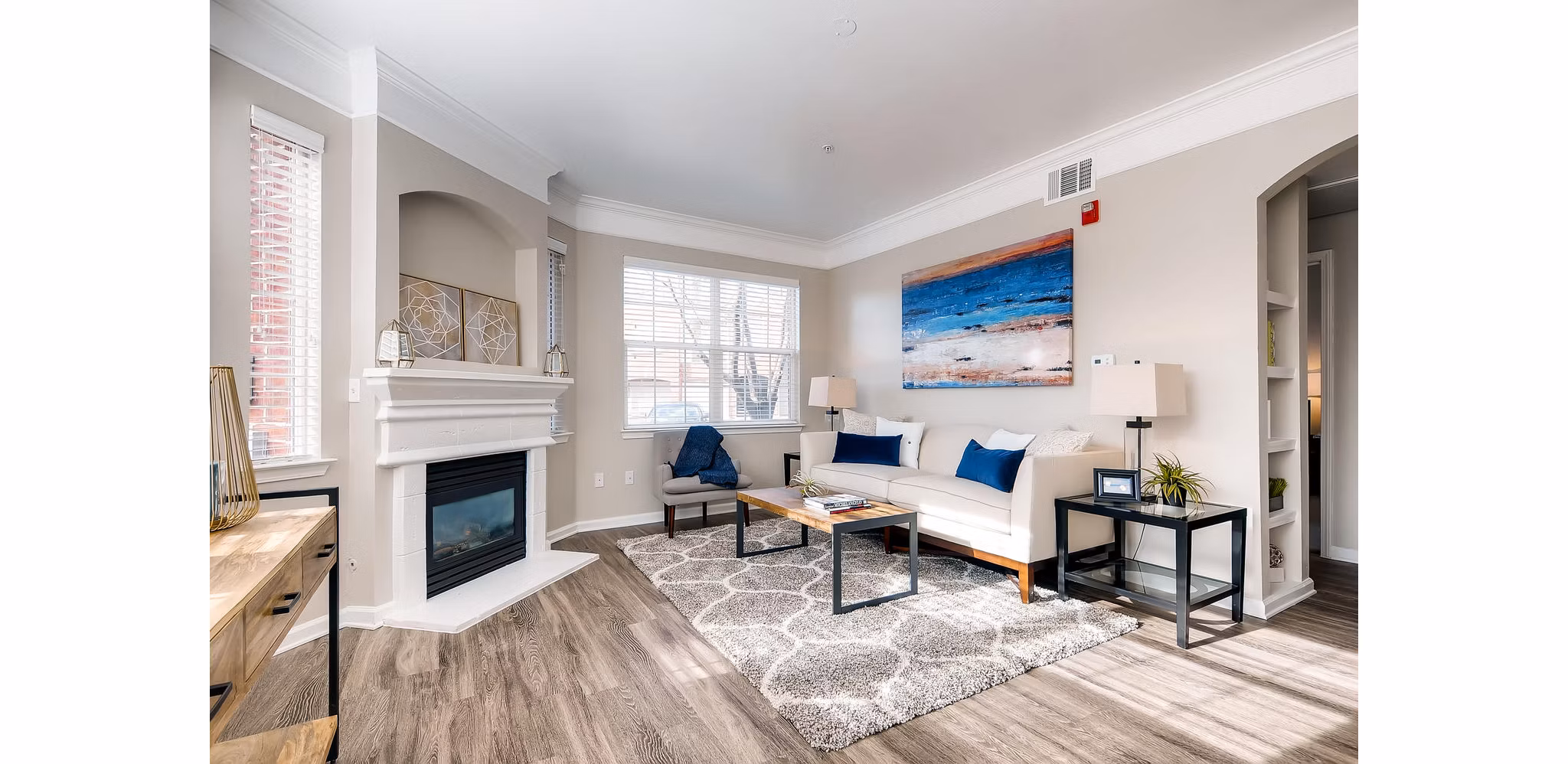 Cozy living room with modern decor at Lowry Park Apartments, featuring comfortable seating and natural light